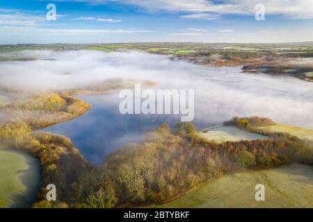 View by drone of morning mist in winter over Roadford Lake in Devon, England, United Kingdom, Europe Stock Photo