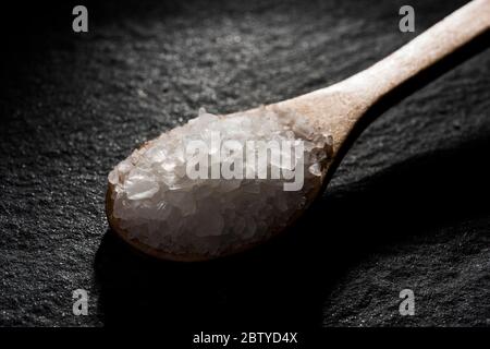 Wooden spoon with condiments Stock Photo