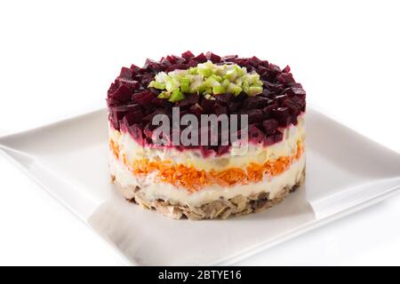 Traditional Russian herring salad with beetroot and carrots isolated on white background Stock Photo