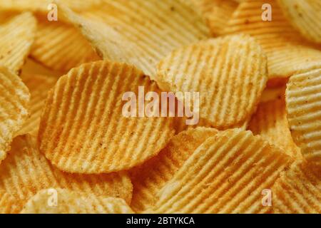 Corrugated Potato Chips. Food background. Top view. Stock Photo