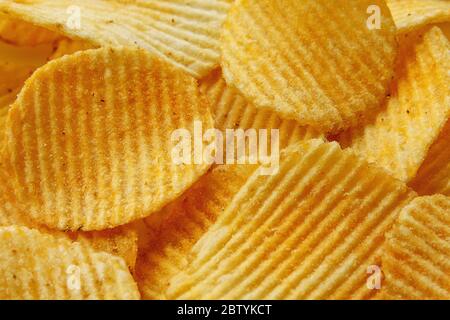Corrugated Potato Chips. Food background. Top view. Stock Photo