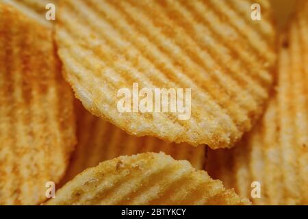 Corrugated Potato Chips. Close-up macro view. Stock Photo