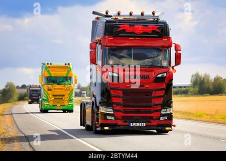 Customised Scania truck Jimmy Rosenqvist Transport AB with more Scania trucks in convoy to Power Truck Show 2019. Luopajarvi, Finland. Aug 8, 2019. Stock Photo