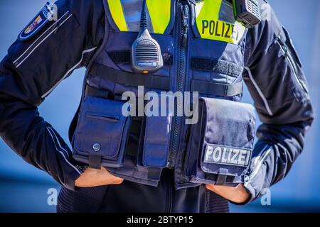 28 May 2020, Mecklenburg-Western Pomerania, Schwerin: Superintendent Katrin Hilberling is wearing one of the new overt vests for equipment which was officially presented by the Mecklenburg-Vorpommern state police. The so-called 'outer carrying case' is a vest that provides additional protection for the police officers and makes it easier to store equipment. Police officers have contributed to the development of the new model with their practical experience. Photo: Jens Büttner/dpa-Zentralbild/dpa Stock Photo