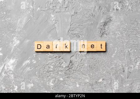 dark net word written on wood block. dark net text on cement table for your desing, concept. Stock Photo