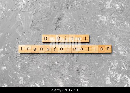 digital transformation word written on wood block. digital transformation text on cement table for your desing, concept. Stock Photo