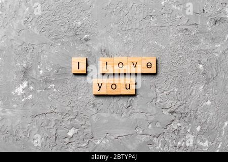 i love you word written on wood block. i love you text on table, concept. Stock Photo