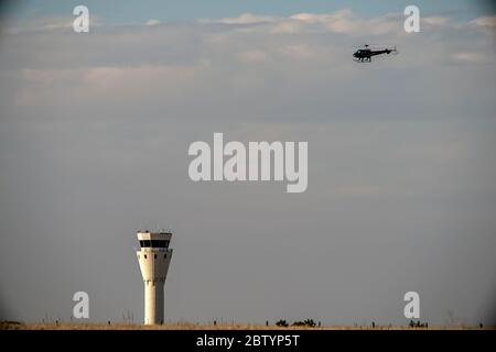 Distant copter in cloudy sky. Copy space Stock Photo - Alamy