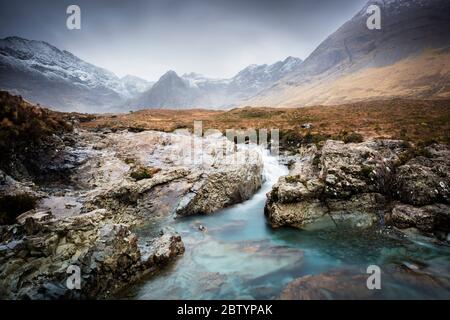 The River Brittle against the backdrop of the Cullin Mountains. Fairy Pools. Glenbrittle, Isle of Skye Stock Photo