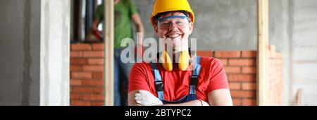 Happy handyman in uniform Stock Photo