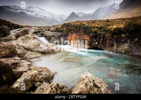 The River Brittle against the backdrop of the Cullin Mountains. Fairy Pools. Glenbrittle, Isle of Skye Stock Photo