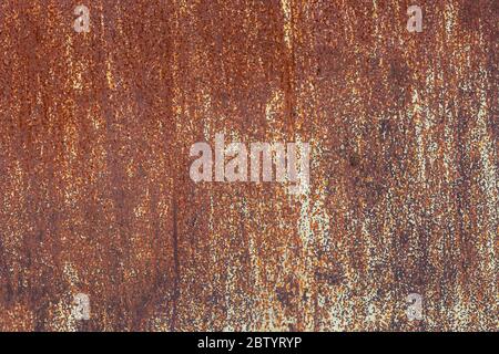 abstract background and texture of with orange rust and leftovers of white paint Stock Photo