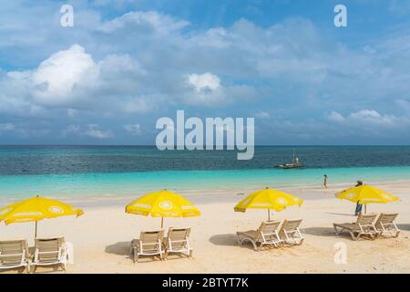 Nungwi Beach, Zanzibar-Tanzania, February 12, 2020 : People at the tropical white beach of Zanzibar island. Tanzania. Eastern Africa, copy space for t Stock Photo