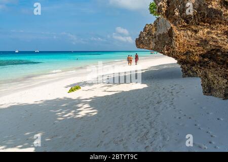 Nungwi Beach, Zanzibar-Tanzania, February 12, 2020 : People at the tropical white beach of Zanzibar island. Tanzania. Eastern Africa, copy space for t Stock Photo