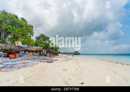 Nungwi Beach, Zanzibar-Tanzania, February 12, 2020 : People at the tropical white beach of Zanzibar island. Tanzania. Eastern Africa, copy space for t Stock Photo