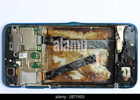 Situation after failed replacing smartphone battery Stock Photo
