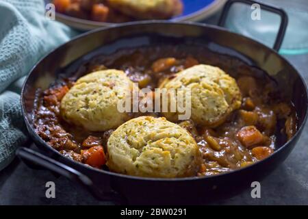 Beef vegetable goulash casserole with potato dumplings Stock Photo