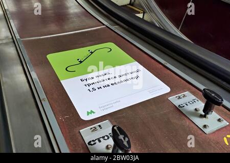 Kiev, Ukraine. 26th May, 2020. Coronavirus awareness sign at the subway station encouraging social distancing after the city metro was reopened as part of another stage to ease the coronavirus disease COVID-19 restrictions in Kiev. Credit: Aleksandr Gusev/SOPA Images/ZUMA Wire/Alamy Live News Stock Photo