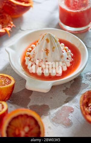 Juicing blood oranges, fresh juice Stock Photo