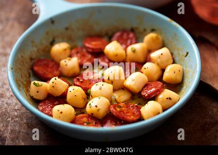 Scallops with chorizo fried on pan Stock Photo