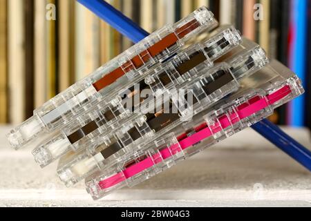 Several compact cassettes and a blue pencil Stock Photo