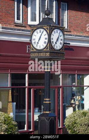 Village centre showing Golden Jubilee Clock and Farrow & Ball shop, Chobham Road, Sunningdale, Berkshire, England, United Kingdom Stock Photo