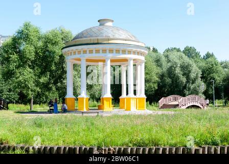 Moscow, Russia, July 13, 2014: Pavilion Air Temple in a city park on the banks of the Yauza River. The family is resting in the shadow of the rotunda. Stock Photo