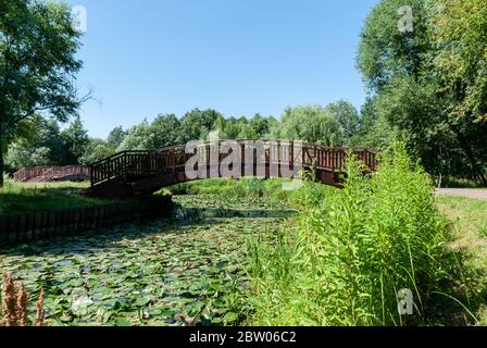 Moscow, Russia, July 13, 2014: Wooden bridges over the Yauza river. Arches of bridges. Stock Photo