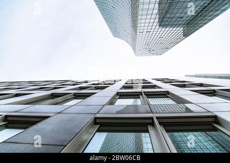 view of vertically rising walls of two skyscrapers Stock Photo