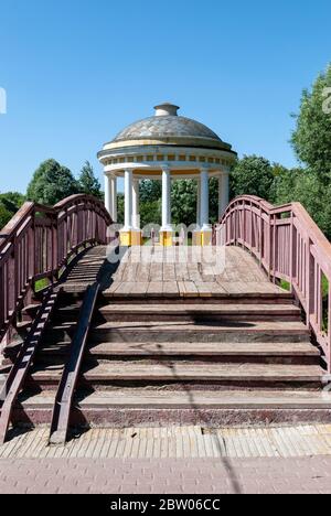 Moscow, Russia, July 13, 2014: Pavilion Air Temple in a city park on the banks of the Yauza River. Wooden bridge to the rotunda. Stock Photo