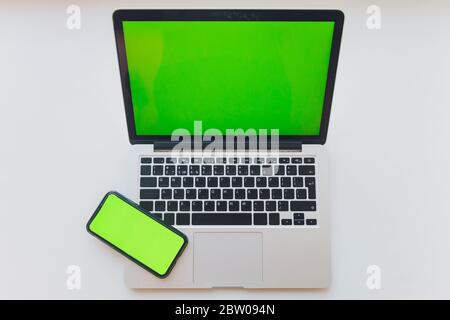 watch by use multiple internet electronic devices with green screen Stock Photo