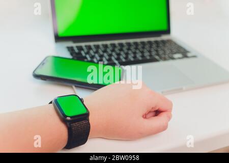 watch by use multiple internet electronic devices with green screen Stock Photo