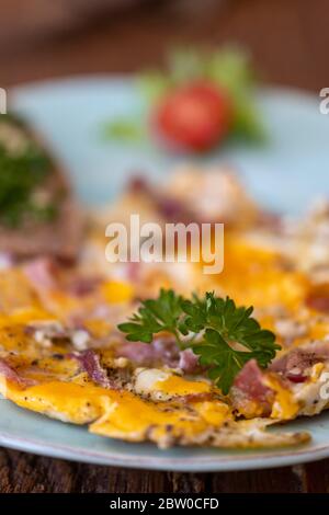 scrambled eggs on a blue plate Stock Photo