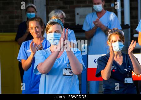 Dorset County Hospital, Dorchester, Dorset, UK.  28th May 2020.  Doctors, Nurses and frontline staff outside the Accident and Emergency entrance at Dorset County Hospital at Dorchester in Dorset to clap for the final time for the NHS, Carers, Key Workers and Front Line staff.  Picture Credit: Graham Hunt/Alamy Live News Stock Photo