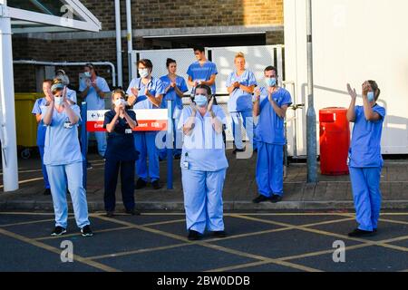 Dorset County Hospital, Dorchester, Dorset, UK.  28th May 2020.  Doctors, Nurses and frontline staff outside the Accident and Emergency entrance at Dorset County Hospital at Dorchester in Dorset to clap for the final time for the NHS, Carers, Key Workers and Front Line staff.  Picture Credit: Graham Hunt/Alamy Live News Stock Photo