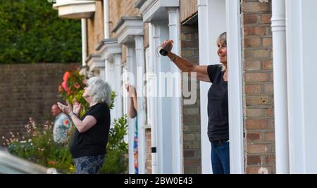 Brighton UK 28th May 2020 - Residents and neighbours of Queens Park in Brighton join in the Clap For Our Carers for NHS staff and Key Workers tonight during the coronavirus COVID-19 pandemic . : Credit Simon Dack / Alamy Live News Stock Photo