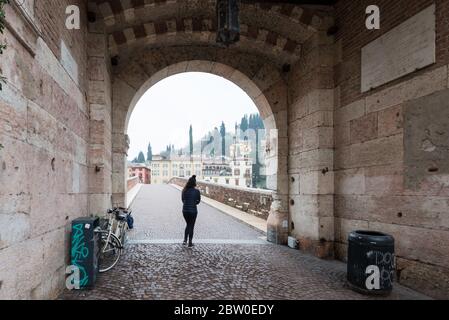 VERONA, ITALY - 14, MARCH, 2018: Wide angle picture of Ponte Pietra, a famous bridge of Verona, Italy Stock Photo