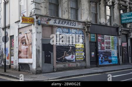 Old closed down shops on a run down backstreet in London Stock Photo