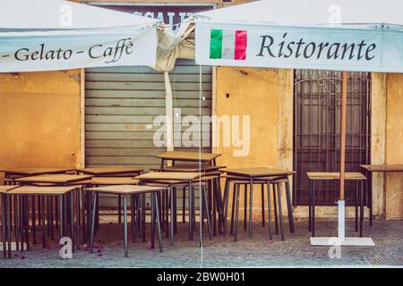 Italian restaurant closed during the world pandemic caused by the coronavirus. Economic crisis in Italy. Poverty during Covid-19 infection. Translatio Stock Photo