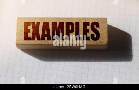 examples word written on wood block. examples text on table, concept ...