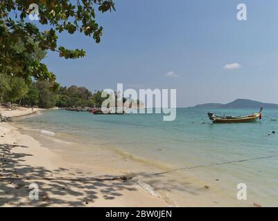 dh Rawai beach PHUKET THAILAND Longtail fishing boats in sandy bay boat Stock Photo