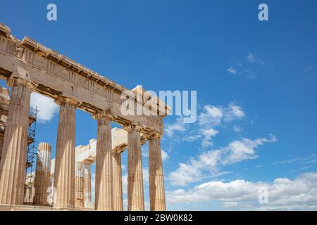 Athens Acropolis, Greece. Parthenon temple dedicated to goddess Athena, detail of ancient temple ruins, blue sky background in spring sunny day. Stock Photo
