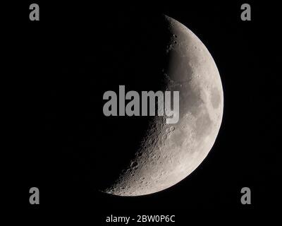 Sheerness, Kent, UK. 28th May, 2020. The waxing crescent moon on a very clear evening above Sheerness, Kent. Credit: James Bell/Alamy Live News Stock Photo