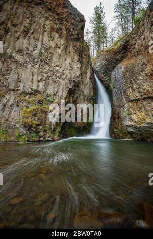 The beautiful Hawk Creek Falls northwest of Davenport Washington near the Spokane river meeting the Columbia River. Stock Photo