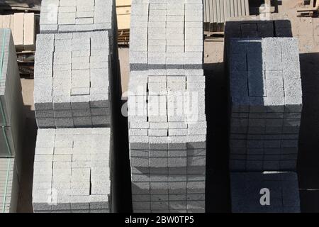 Large stacks of concrete bricks at an building supplier Stock Photo