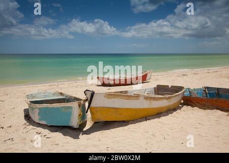 Rustic fishing boats on a white sand beach in Mexico Stock Photo