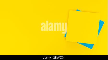 Colored paper stickers on a yellow background, space for text, ad unit Stock Photo