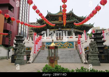 Mazu Miao Temple with Chinese lanterns hanging in Chinatown. Yokohama, Japan Stock Photo