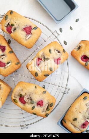 Homemade mini banana and raspberry loaf cakes Stock Photo
