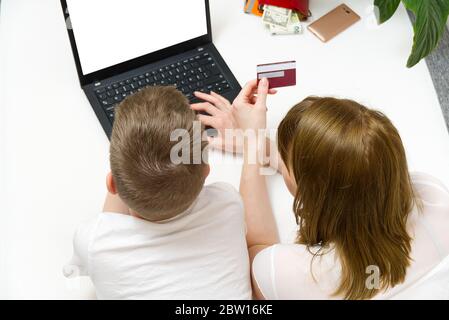 Mother with son making online shopping in laptop. Online shopping with laptop from home concept. mock up. Stock Photo